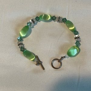 Green jewel bracelet.